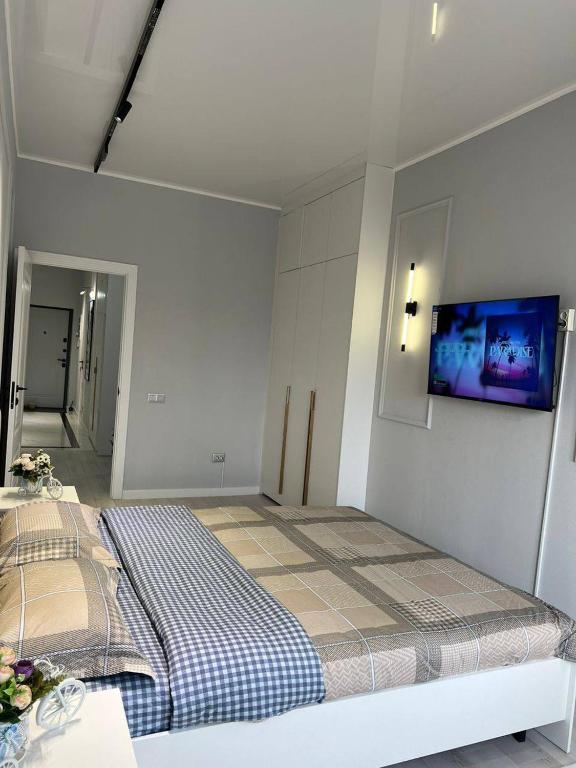 Ένα ή περισσότερα κρεβάτια σε δωμάτιο στο Victory apartment near GUM-TSUM