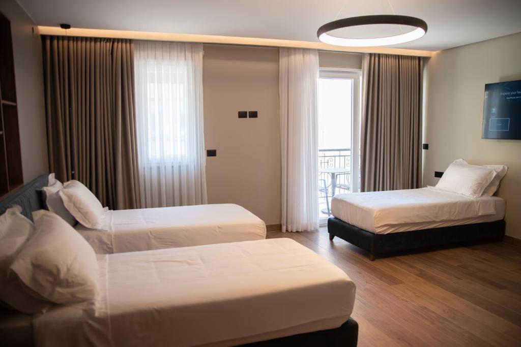A bed or beds in a room at Hotel Mozart