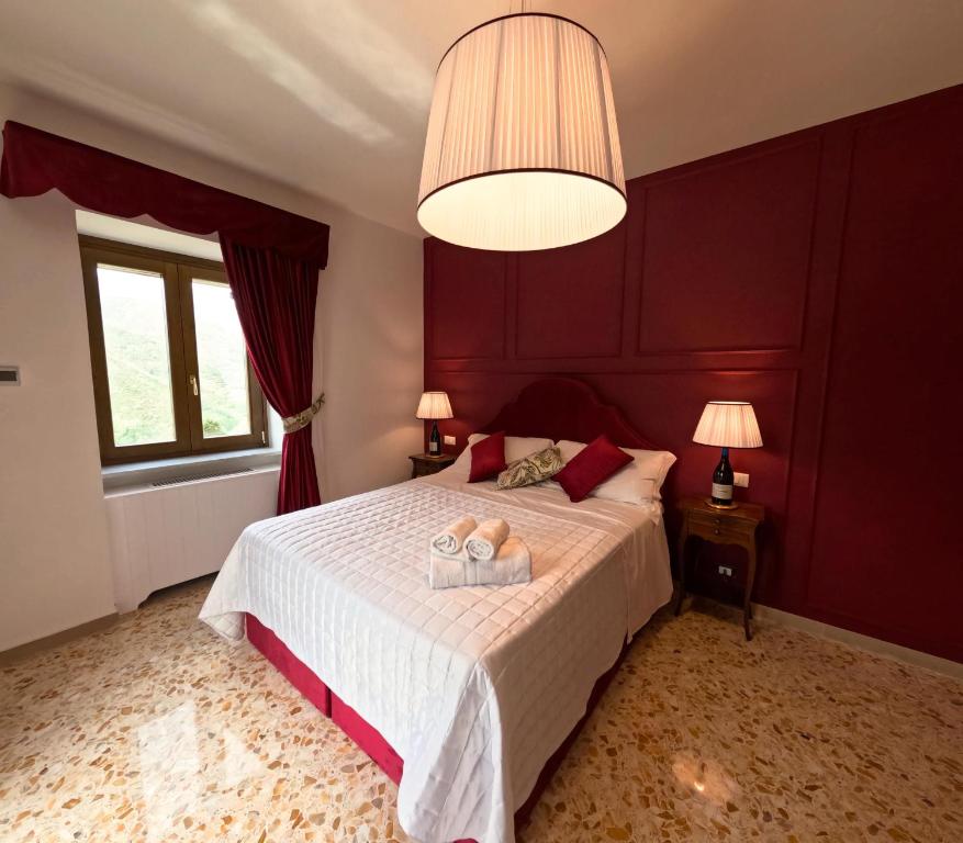 Postel nebo postele na pokoji v ubytování Reale Wine Resort