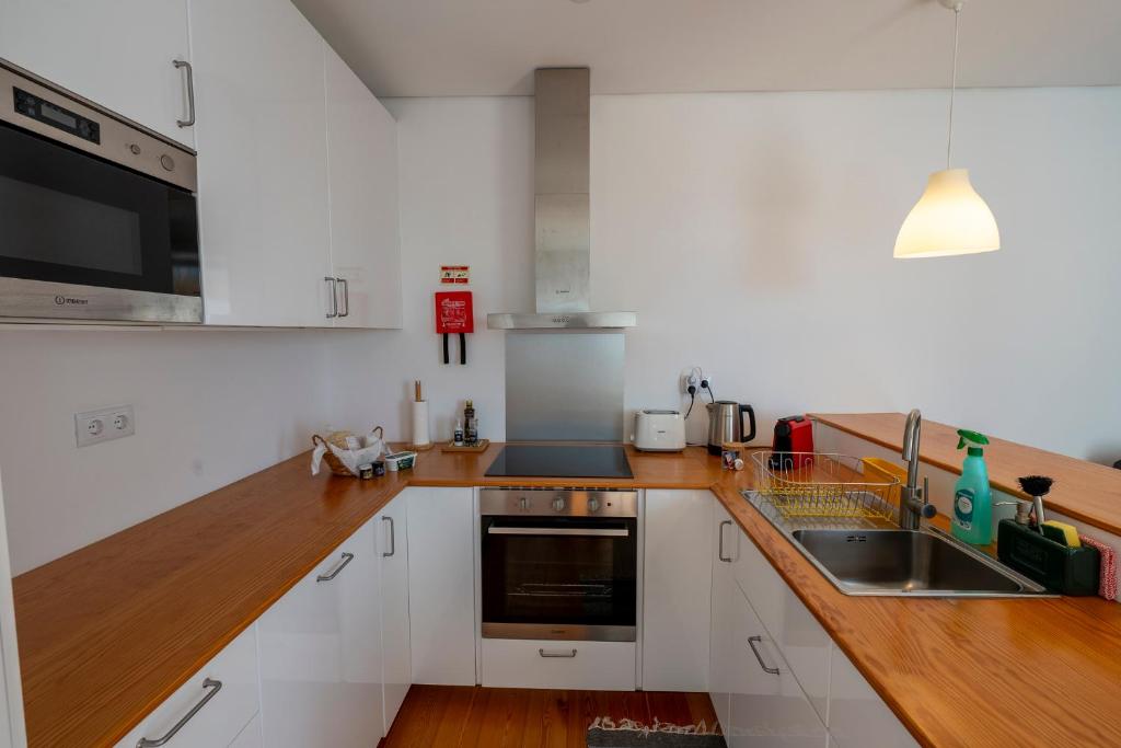 Kuchyň nebo kuchyňský kout v ubytování Casa dos Remedios
