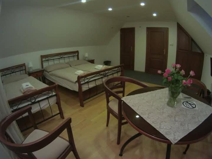 Postel nebo postele na pokoji v ubytování Tri Korunky
