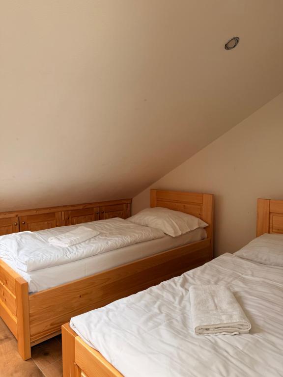 Postel nebo postele na pokoji v ubytování Hotel & wellness Hejtmanka