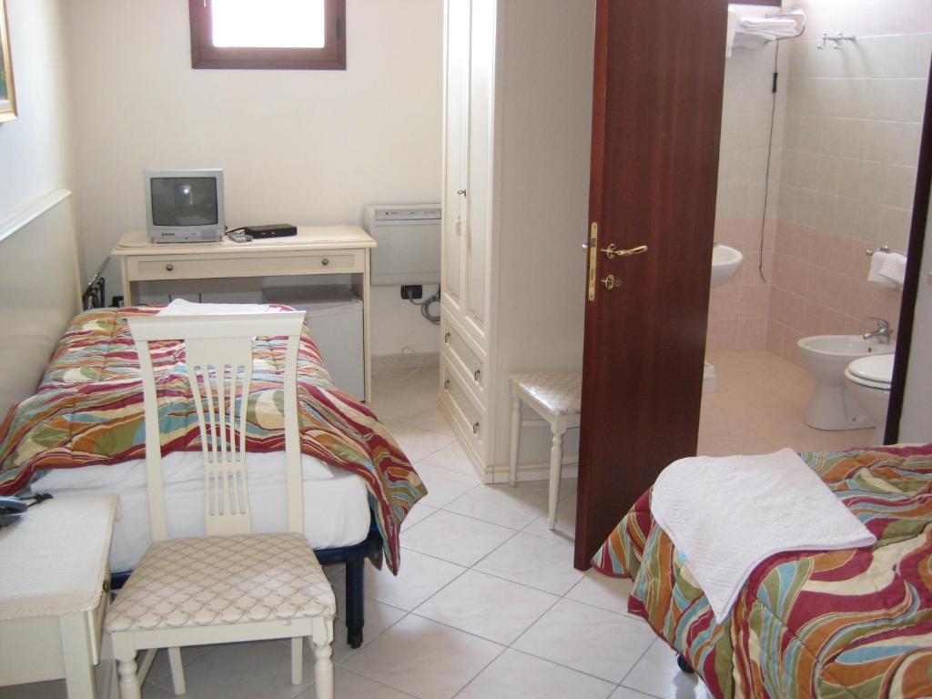 Postel nebo postele na pokoji v ubytování Scano Comfort Inn