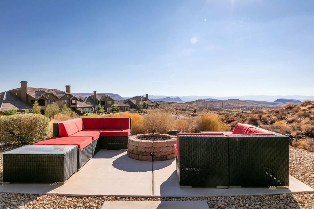 a patio with two couches and a fire pit at Sunset on the 5th in Washington