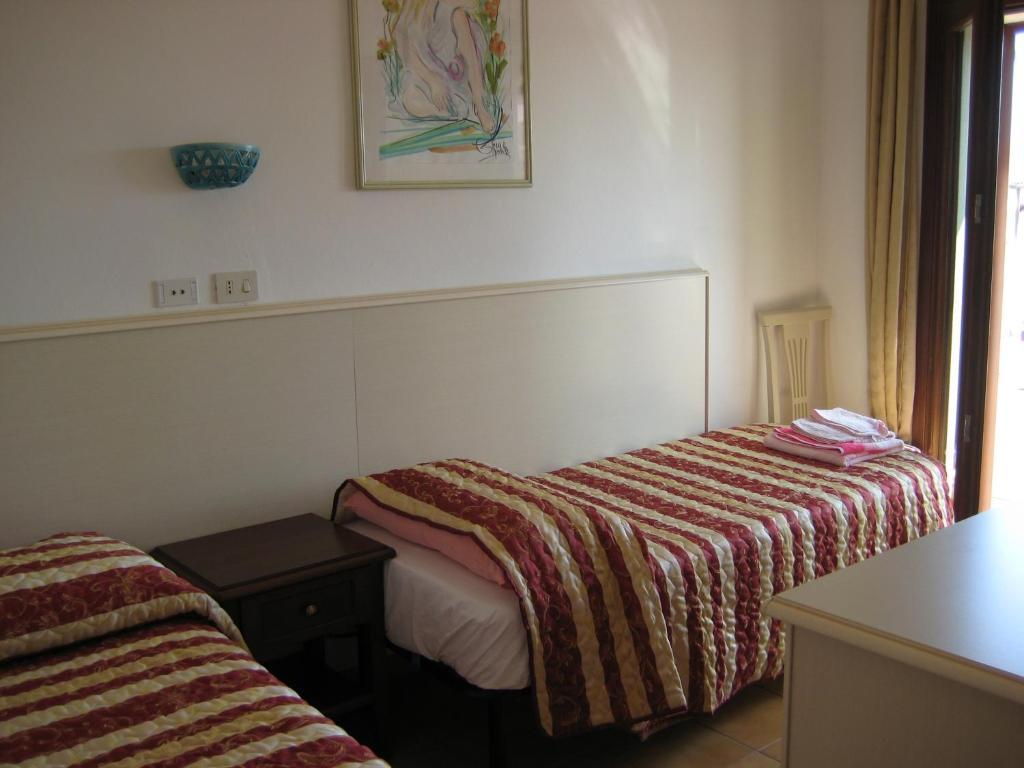 Postel nebo postele na pokoji v ubytování Scano Comfort Inn
