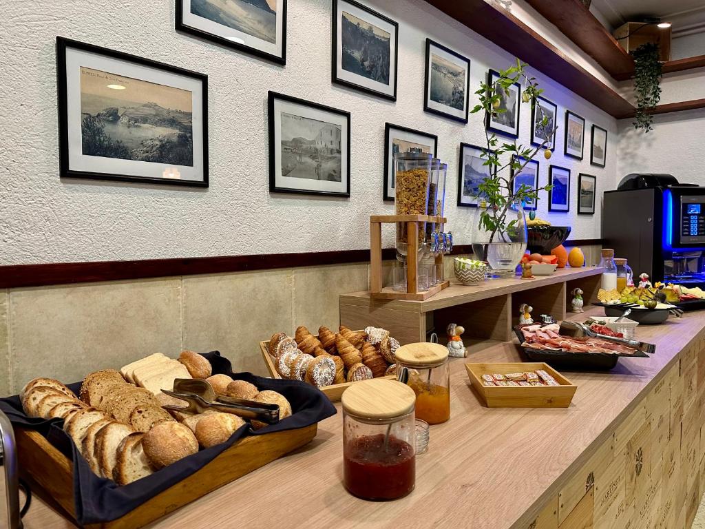 a bakery with bread and other foods on a counter at Hostal Regina in Blanes
