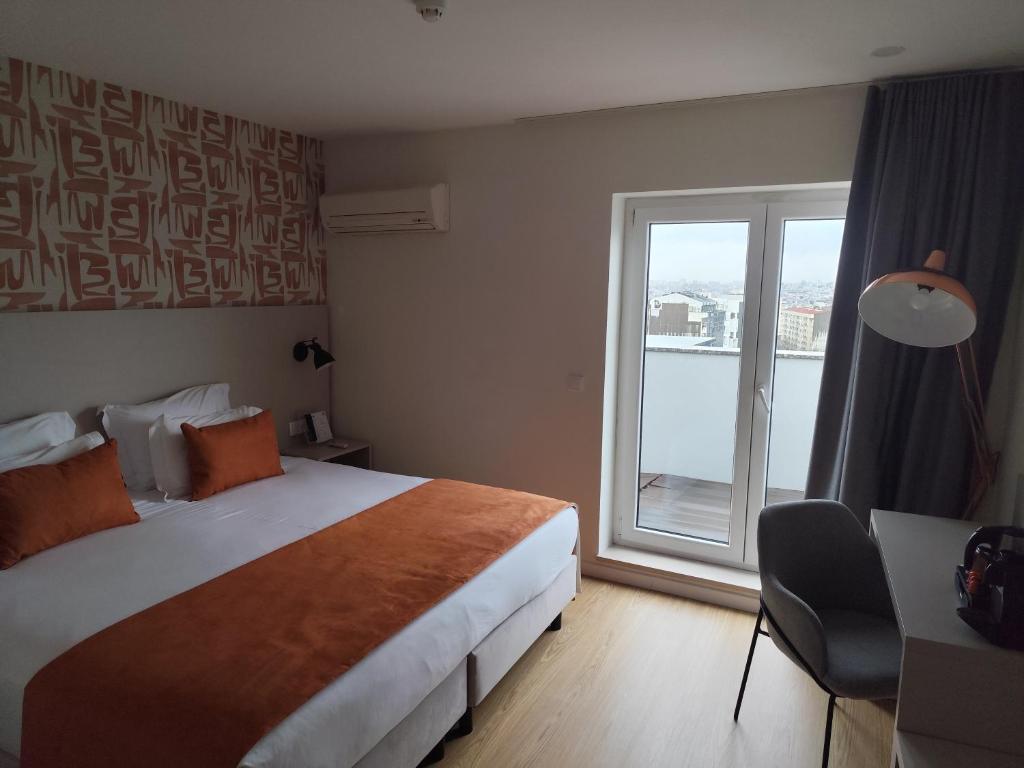 Cama ou camas em um quarto em ClipHotel
