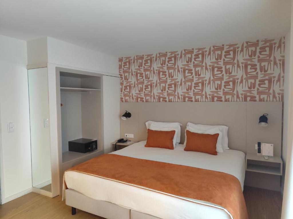 Cama ou camas em um quarto em ClipHotel
