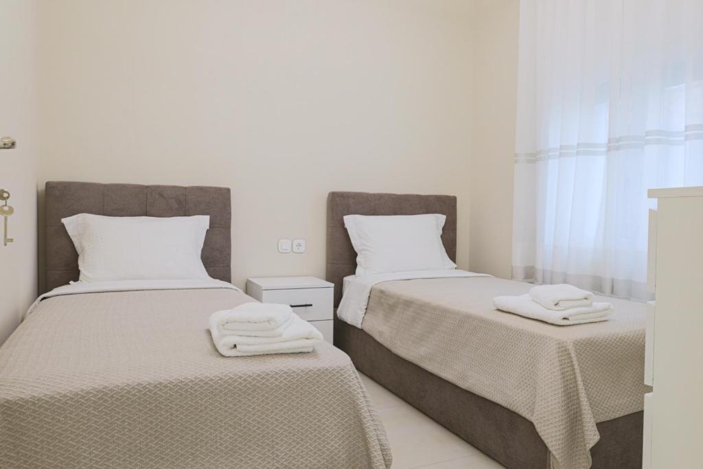 Postel nebo postele na pokoji v ubytování Mourati House
