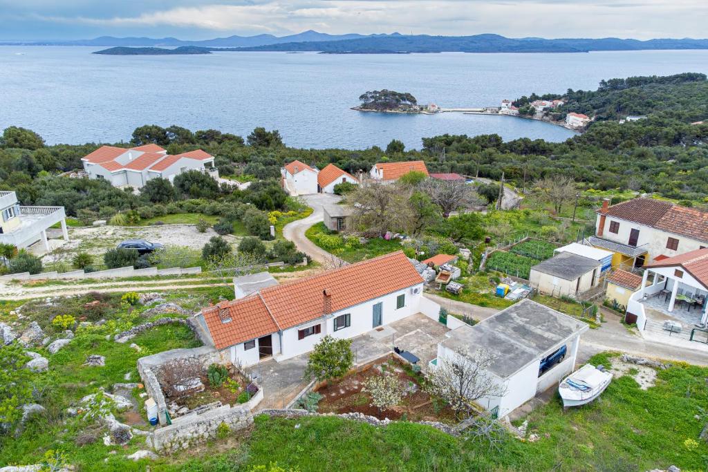 an aerial view of a house and the water at Apartments with parking space Savar, Dugi otok - 12762 in Brbinj