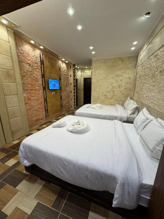 Postel nebo postele na pokoji v ubytování Vida Pyramids Inn