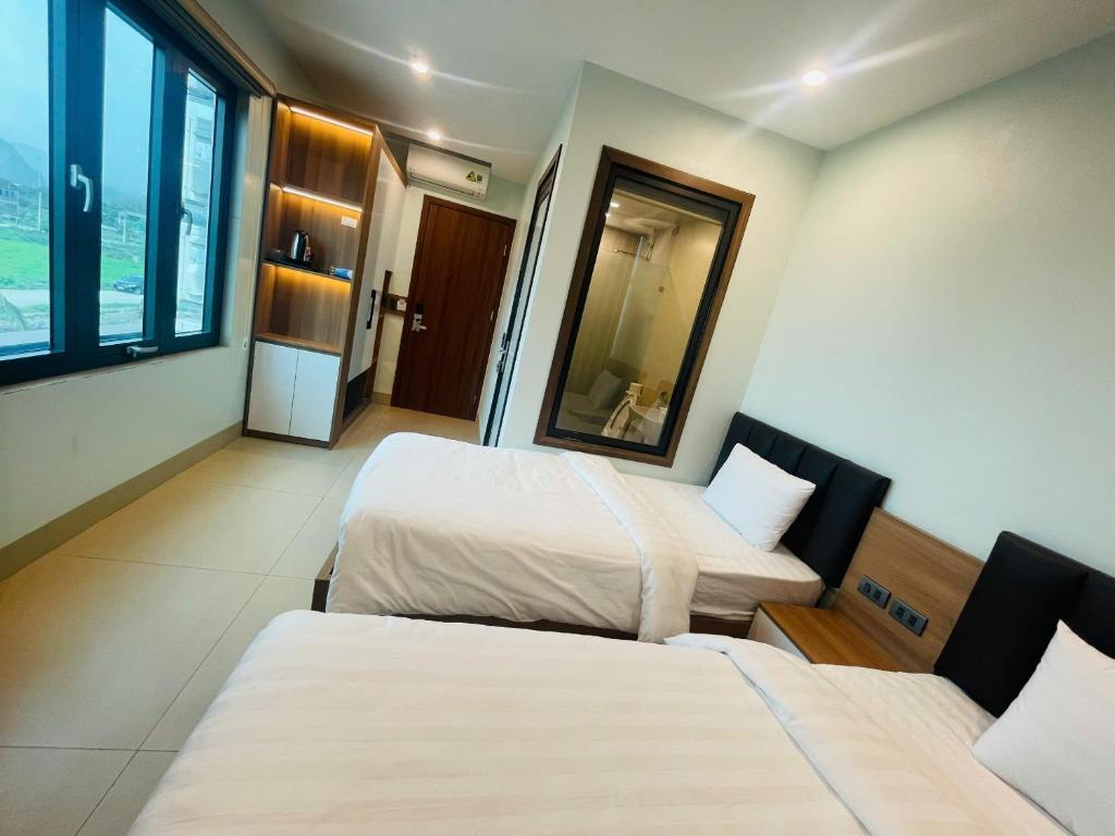 Postel nebo postele na pokoji v ubytování Tam Coc Guest House One & Hotel Ninh Binh