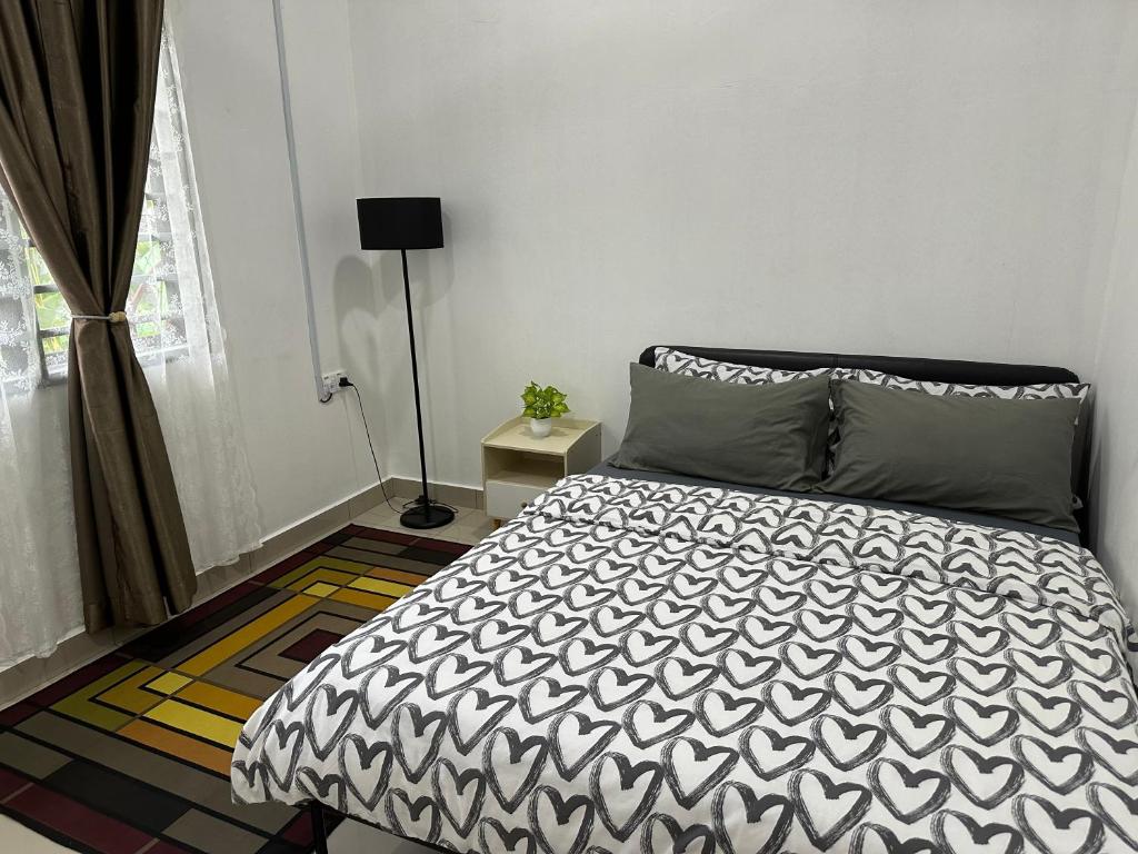 Postel nebo postele na pokoji v ubytování Mummy Firdhan Homestay