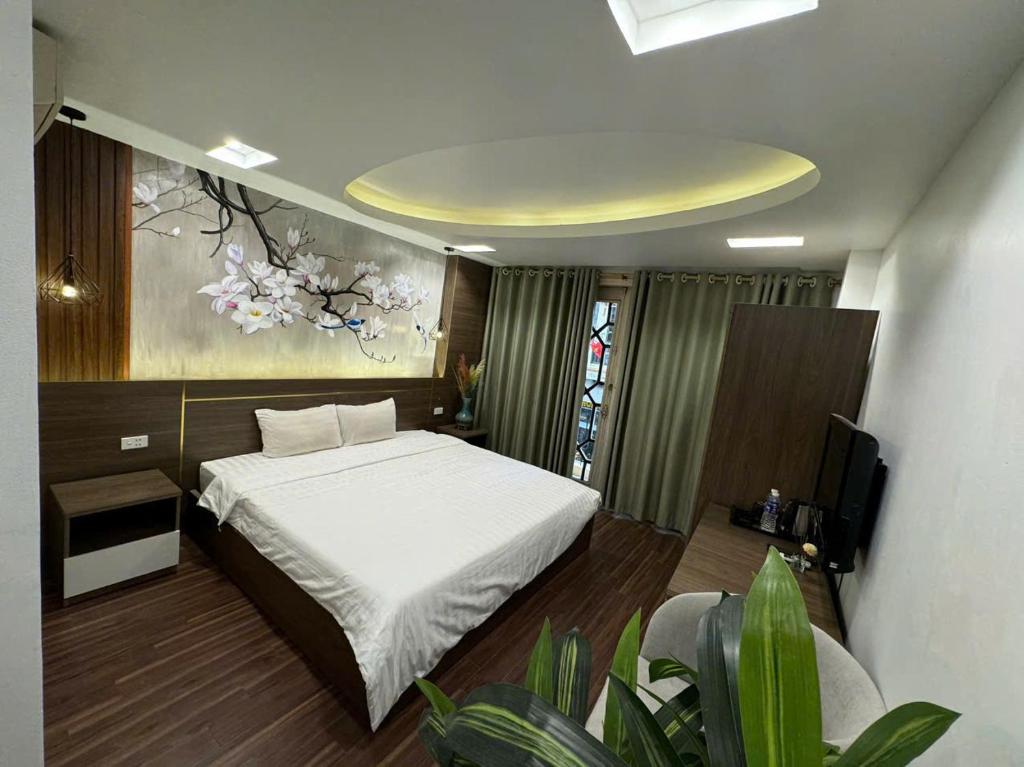 Postel nebo postele na pokoji v ubytování Hanoi Van Hoa Hotel