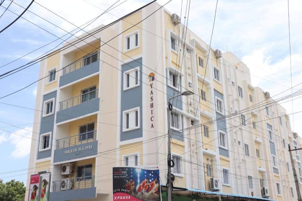 a large white building with a lot of windows at Hotel Starlight Chennai near DLF,L&T,Miot,Tradecenter,Ramachandra medical coll in Chennai