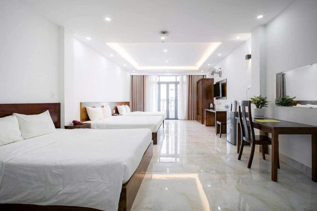 Postel nebo postele na pokoji v ubytování Hồng Gấm Hotel