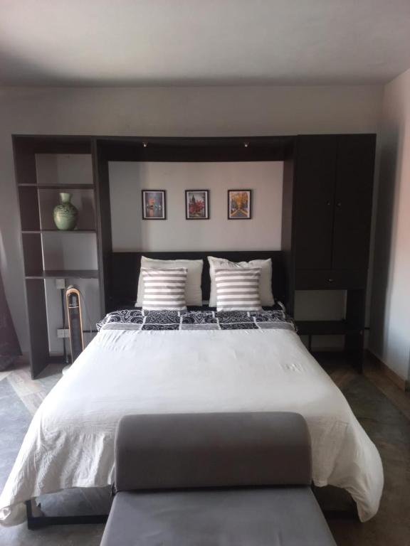Postel nebo postele na pokoji v ubytování Suites Santa Noche & Spa