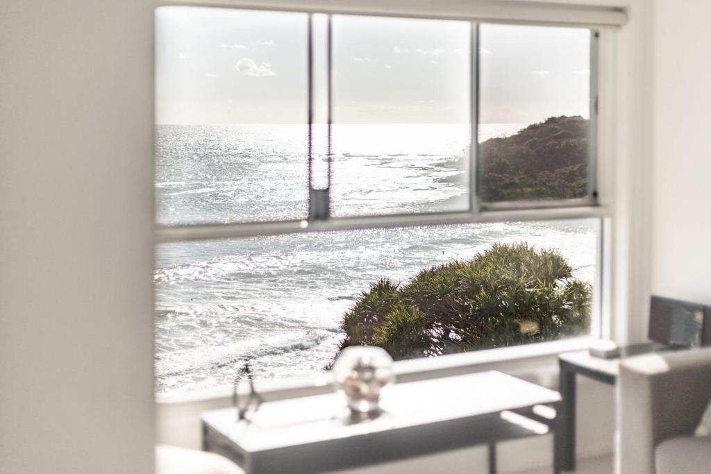 a bathroom window with a view of the ocean at Avalon 3 in Yamba