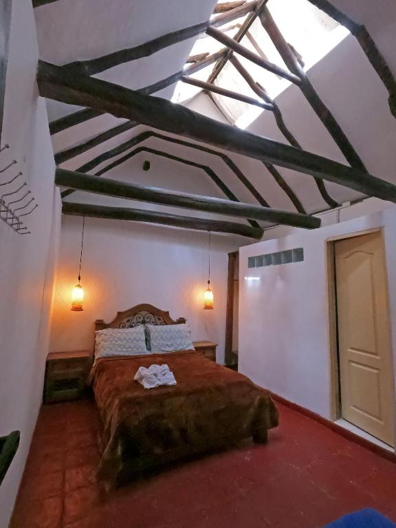 Postel nebo postele na pokoji v ubytování Ulucaho Hostel