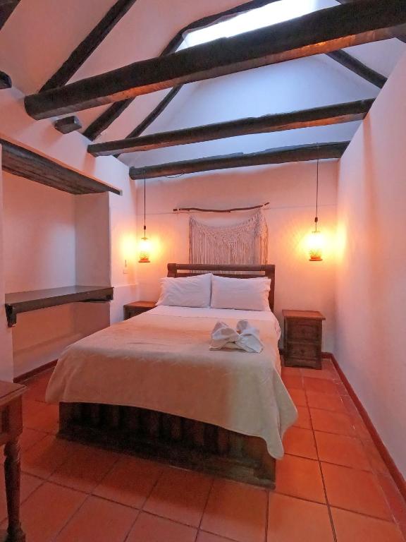 Postel nebo postele na pokoji v ubytování Ulucaho Hostel