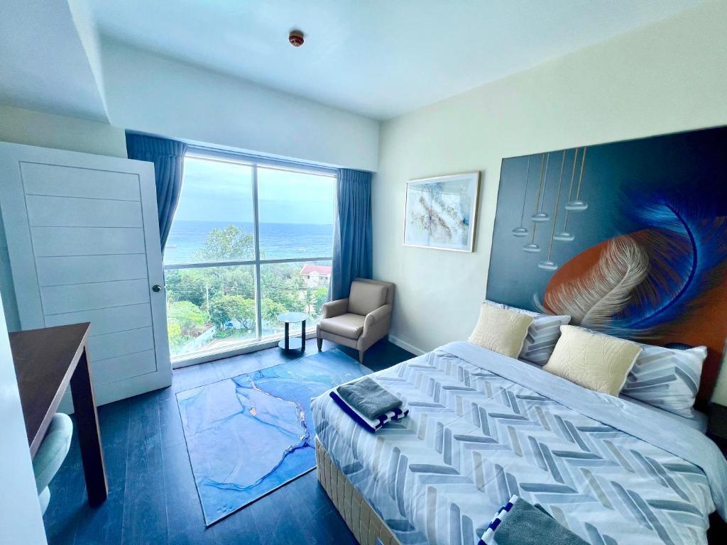 Postel nebo postele na pokoji v ubytování La Mirada Deluxe Suites with Oceanview