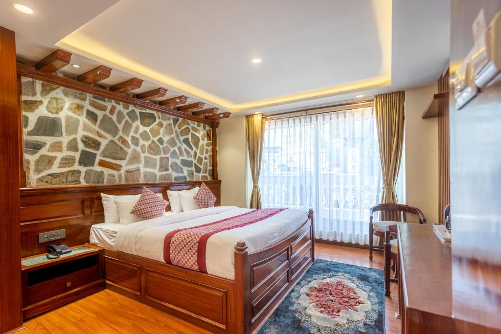 Postel nebo postele na pokoji v ubytování Amarawati Boutique Hotel