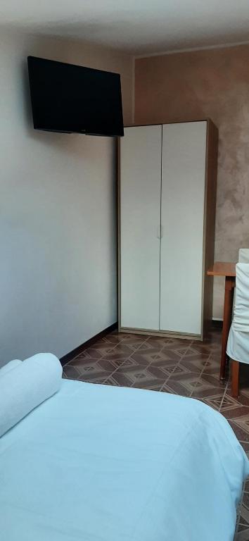 Postel nebo postele na pokoji v ubytování Camere Porto Vecchio con parcheggio a pochi passi dal castello