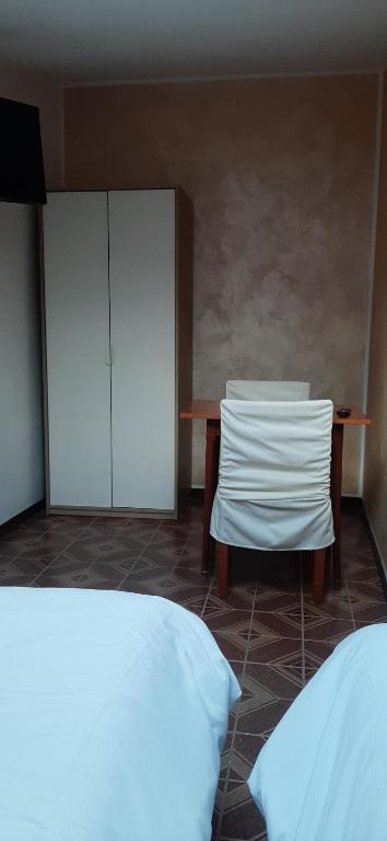 Postel nebo postele na pokoji v ubytování Camere Porto Vecchio con parcheggio a pochi passi dal castello