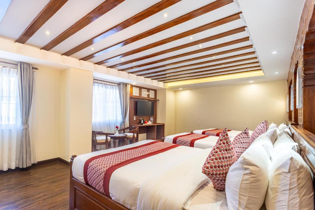 Postel nebo postele na pokoji v ubytování Amarawati Boutique Hotel