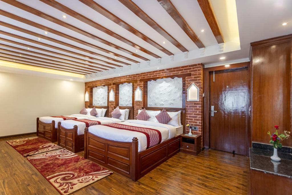 Postel nebo postele na pokoji v ubytování Amarawati Boutique Hotel