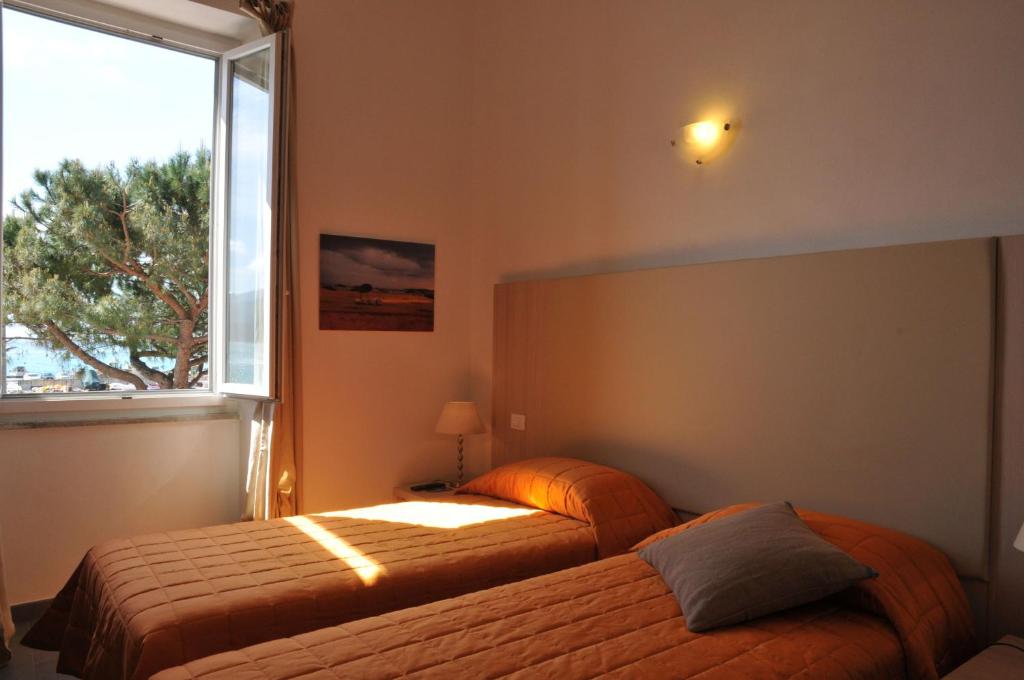 A bed or beds in a room at Affittacamere Da Flo