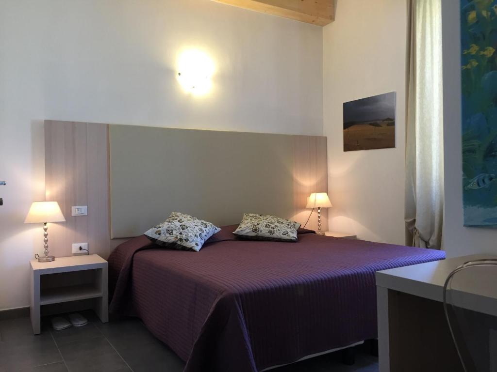 A bed or beds in a room at Affittacamere Da Flo