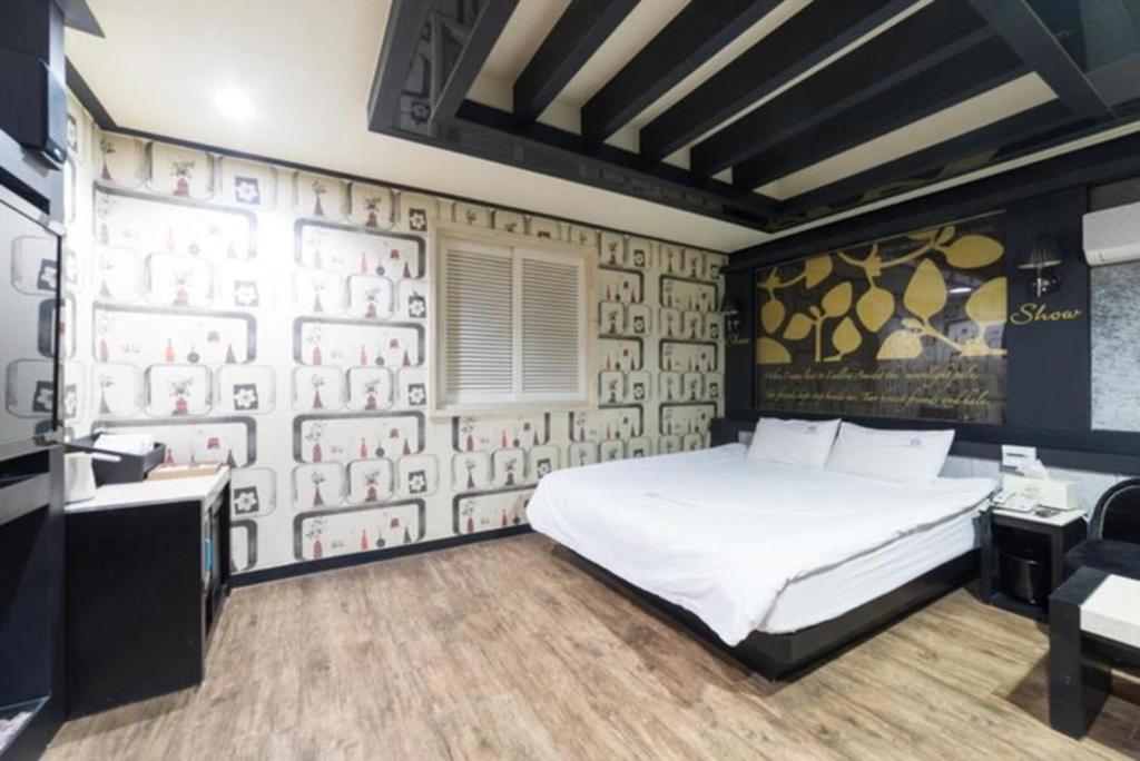 Postel nebo postele na pokoji v ubytování Show Hotel Haeundae