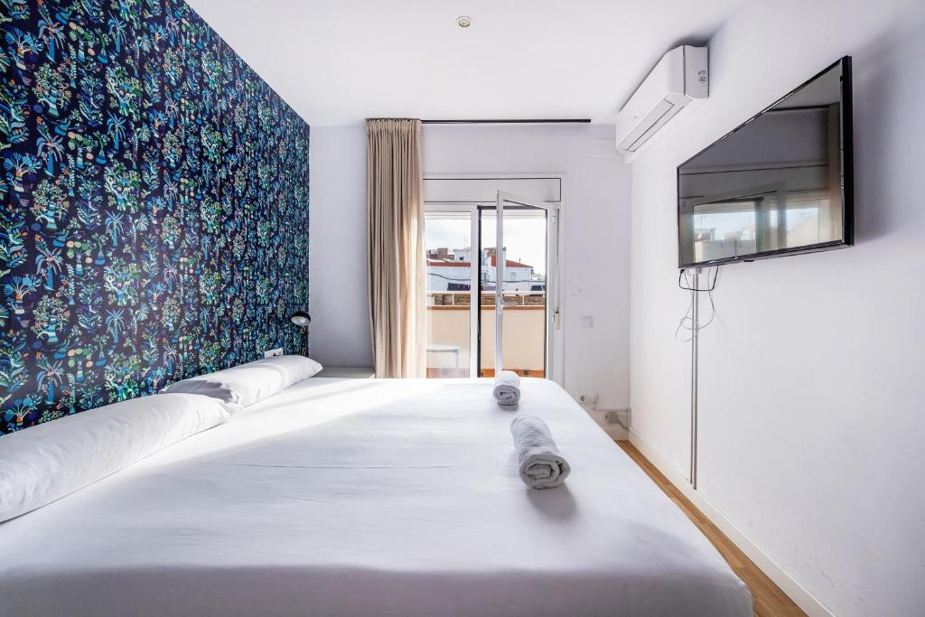 Postel nebo postele na pokoji v ubytování AinB Barcelona Sants Apartments