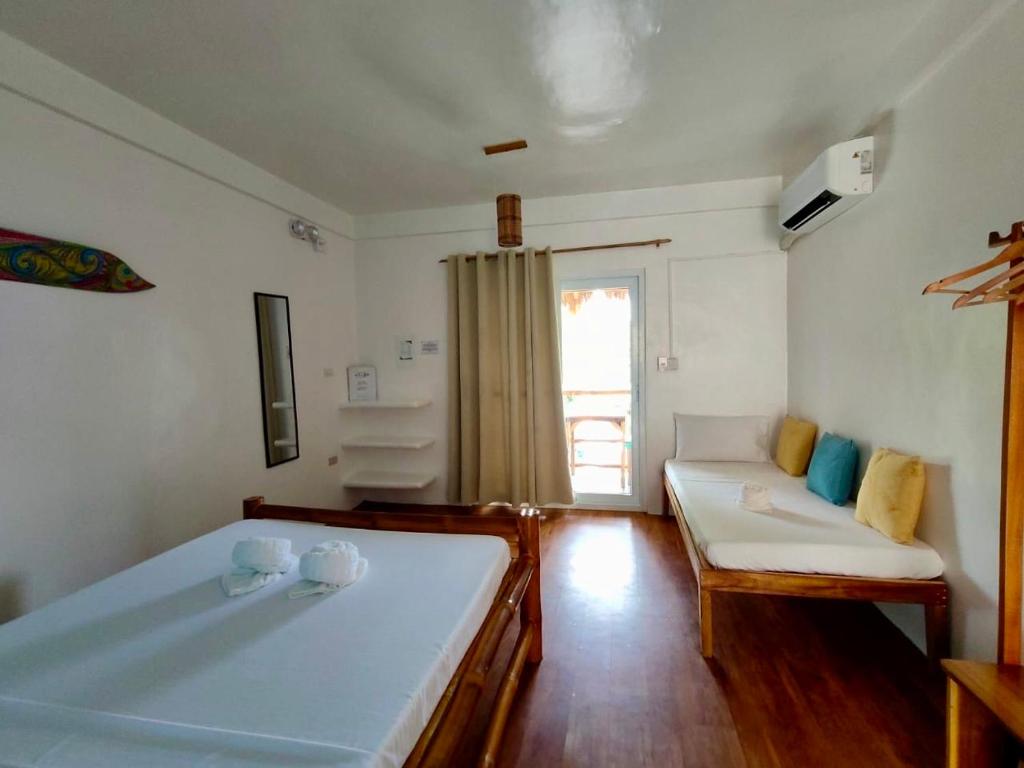 Postel nebo postele na pokoji v ubytování Lunazul Guesthouse