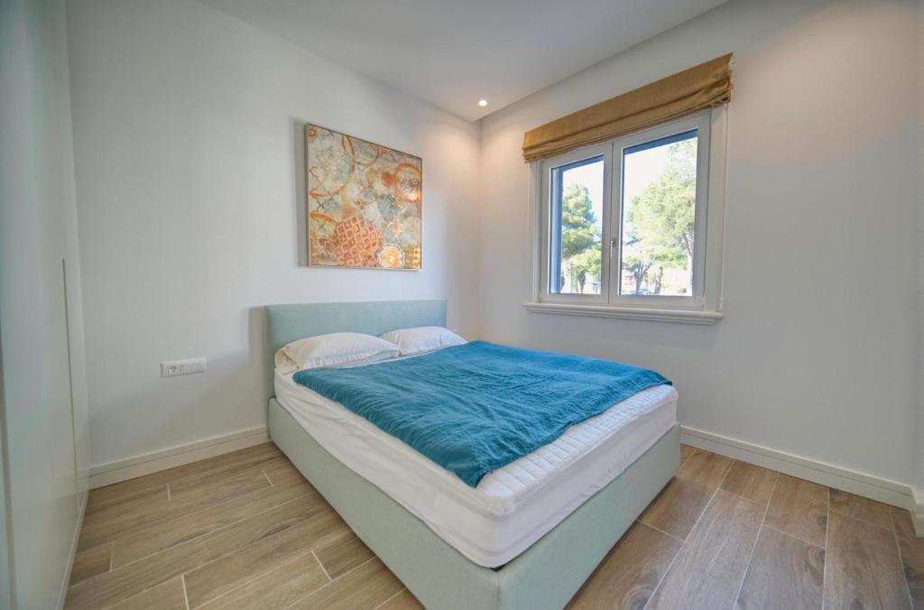 Postel nebo postele na pokoji v ubytování Lustica Bay Centrale by 2BHome