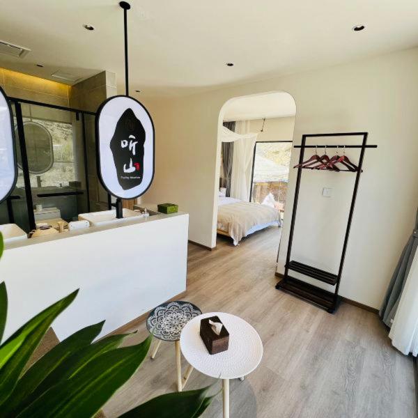 Postel nebo postele na pokoji v ubytování Siguniangshan Town Tingshan Wild Luxury B&B