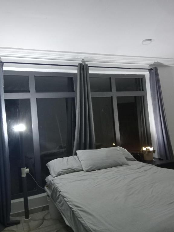 Ένα ή περισσότερα κρεβάτια σε δωμάτιο στο Paradise