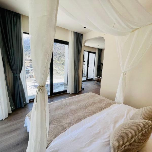 Postel nebo postele na pokoji v ubytování Siguniangshan Town Tingshan Wild Luxury B&B