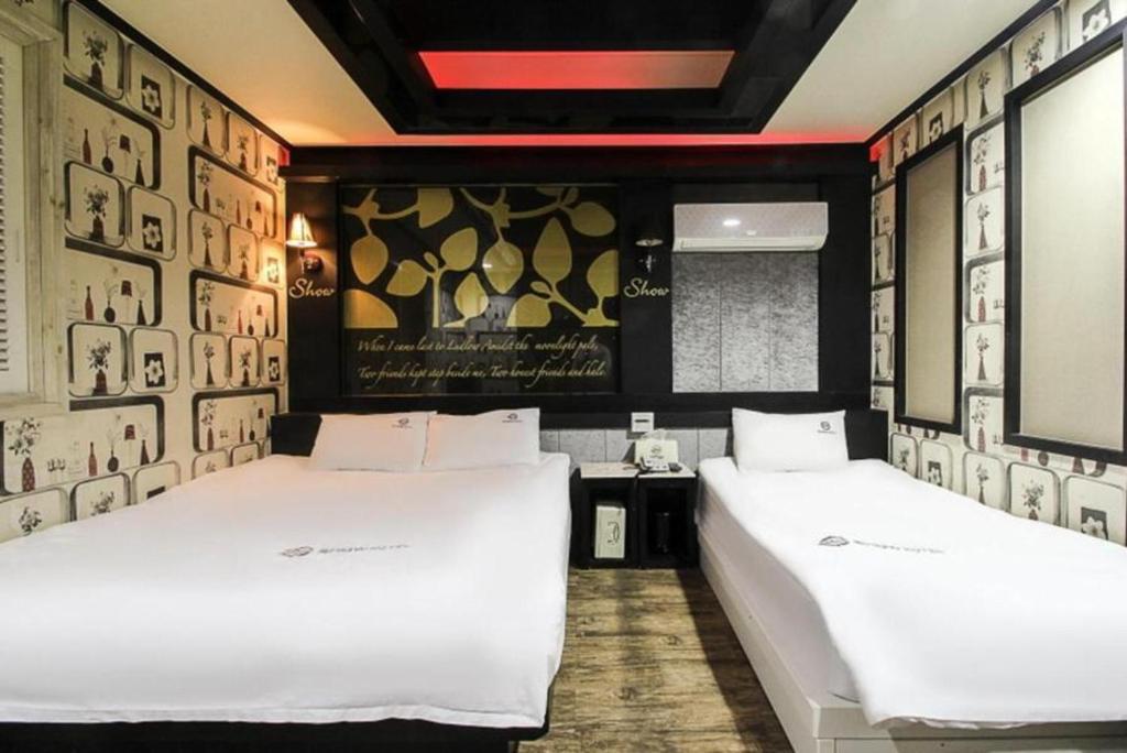 Postel nebo postele na pokoji v ubytování Show Hotel Haeundae