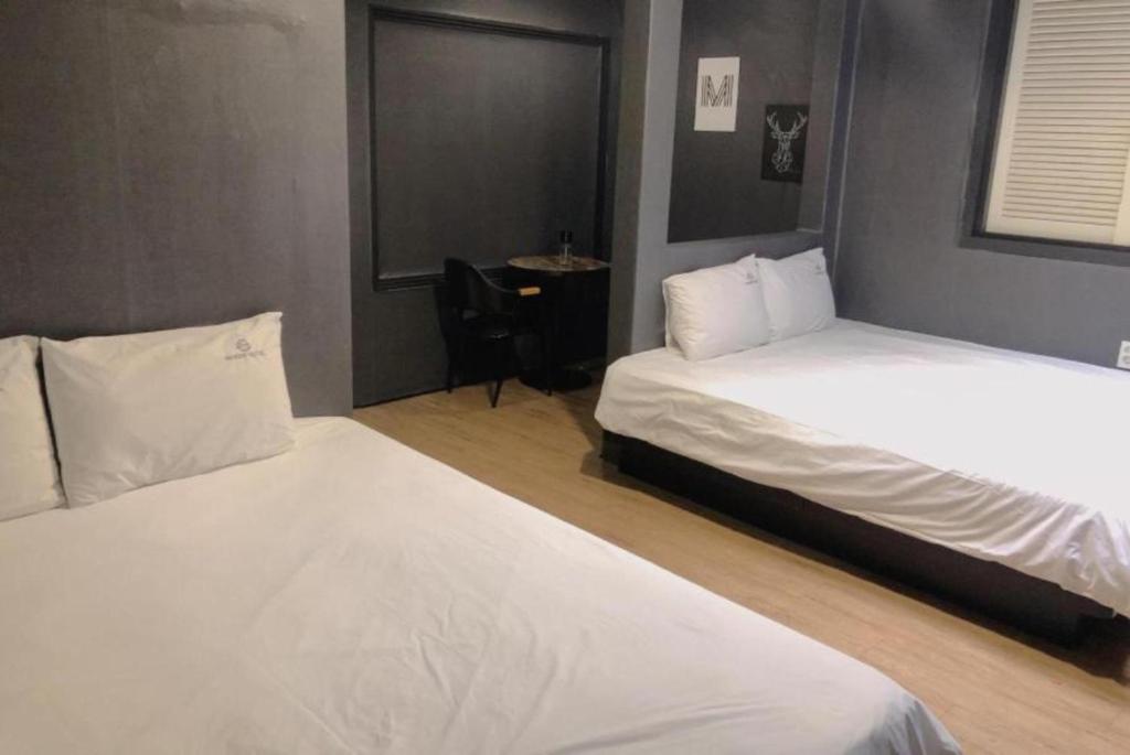 Postel nebo postele na pokoji v ubytování Show Hotel Haeundae