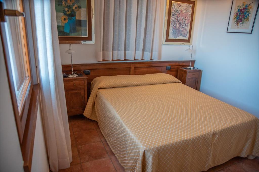 Postel nebo postele na pokoji v ubytování Bio Agriturismo Vojon