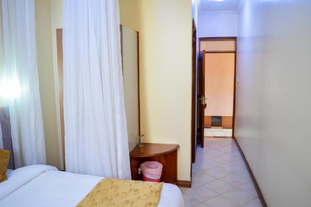 Postel nebo postele na pokoji v ubytování Anthena Hotel