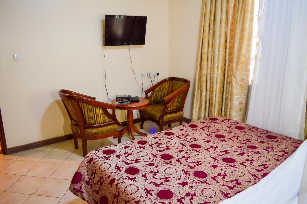 Postel nebo postele na pokoji v ubytování Anthena Hotel