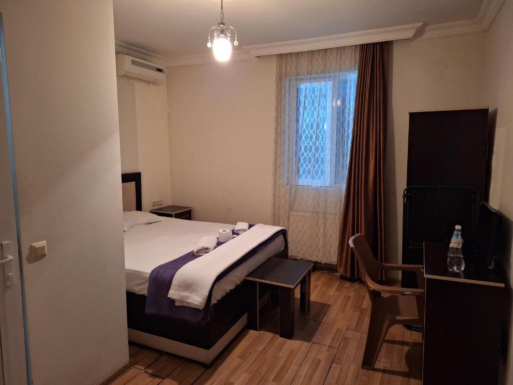 Postel nebo postele na pokoji v ubytování Gold Hotel Batum