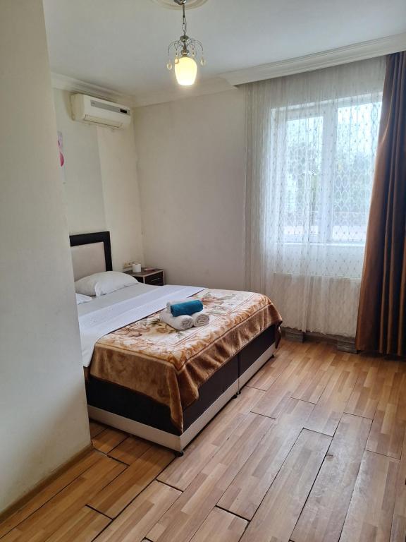 Postel nebo postele na pokoji v ubytování Gold Hotel Batum