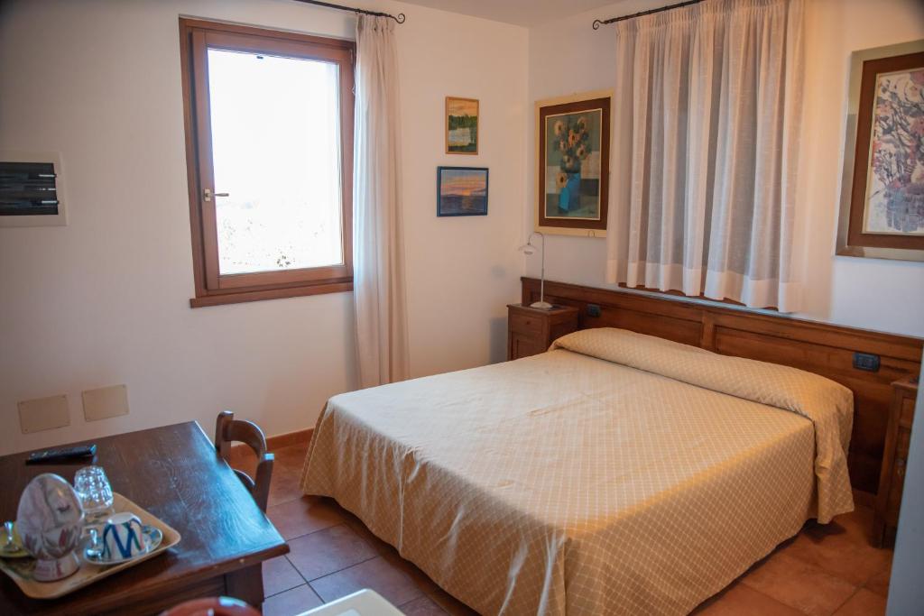 Postel nebo postele na pokoji v ubytování Bio Agriturismo Vojon