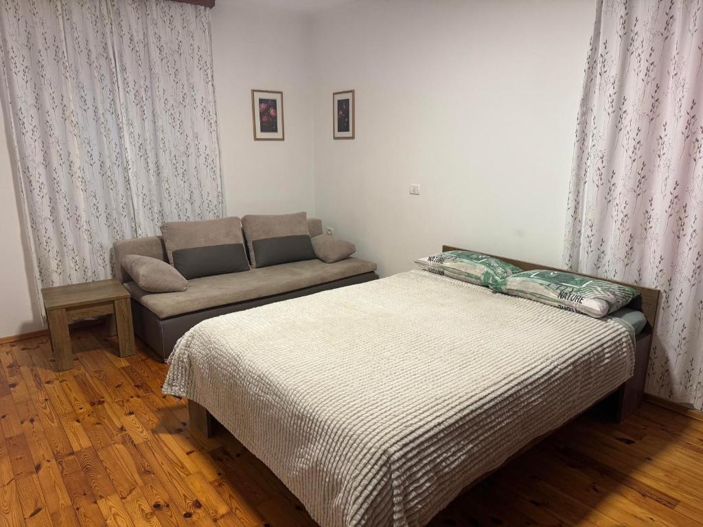 Postel nebo postele na pokoji v ubytování GuestHouse Flora