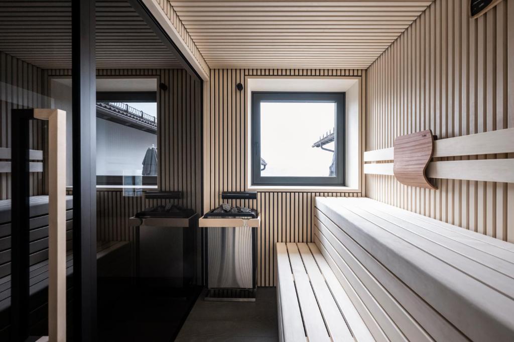 A bed or beds in a room at Hotel Belvedere - Fine Dining, Hideaway & SPA