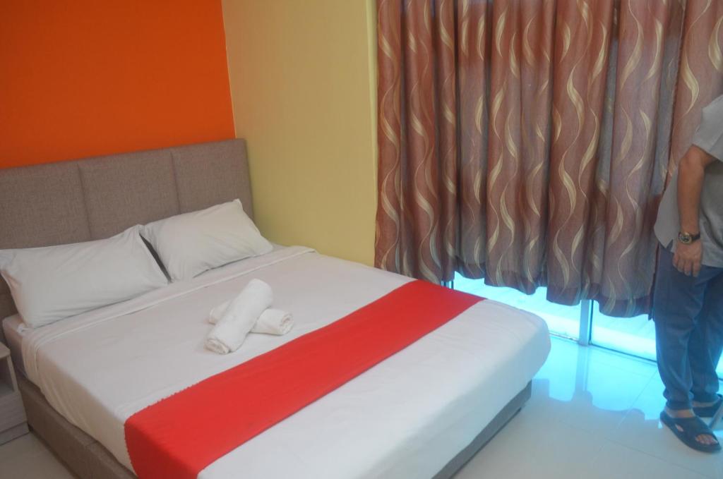 Postel nebo postele na pokoji v ubytování KL Empire Hotel KLIA, Formerly known as Adiff Palace KLIA